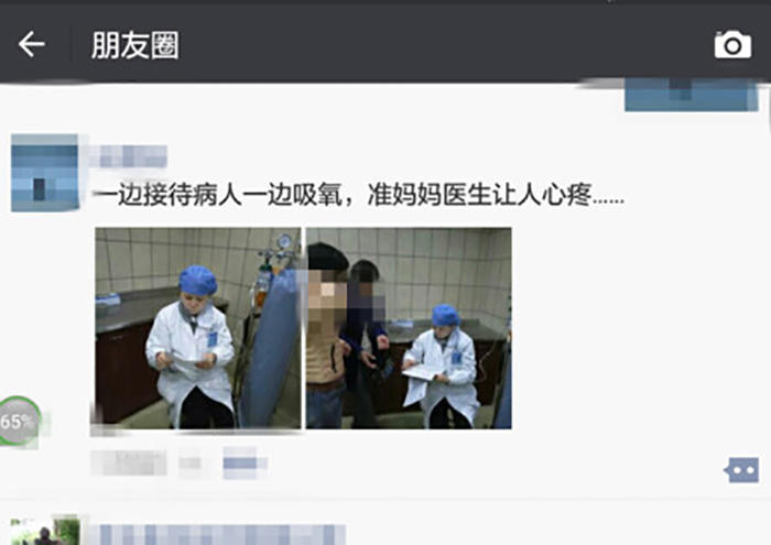 懷孕七月準媽媽醫(yī)生邊吸氧邊給人看病（圖）